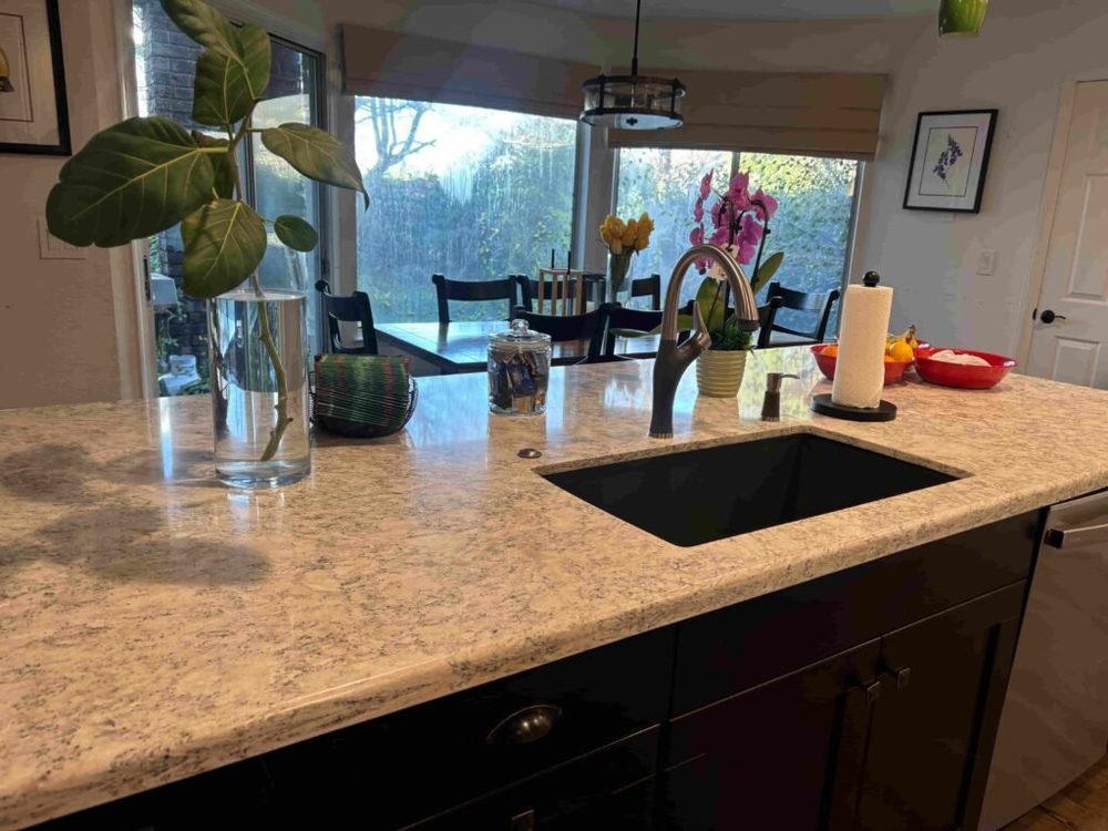 A freshly cleaned kitchen counter and sink by Letty's House Cleaning